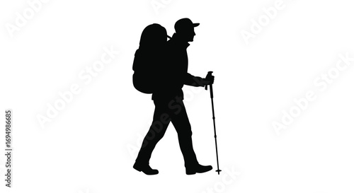 a hiker walking with backpack and trekking poles silhouette