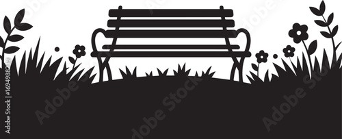 Silhouette of a vintage park bench with surrounding grass and flowers in black and white.