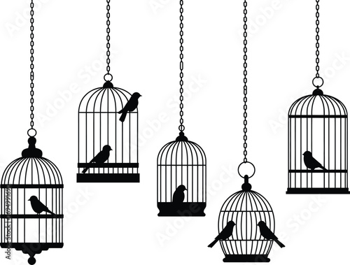 Collection of five vintage bird cages with birds hanging on chains