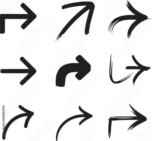 A stark graphic illustration of a versatile set of hand-drawn black arrow icons. Collection of grunge and brush stroke pointers showing direction