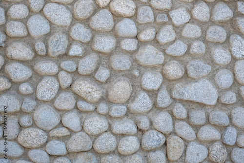 Stone wall texture. Background of rocky wall, cobble pavement materials textured surface.