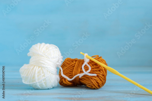 Crochet supplies on blue background. 