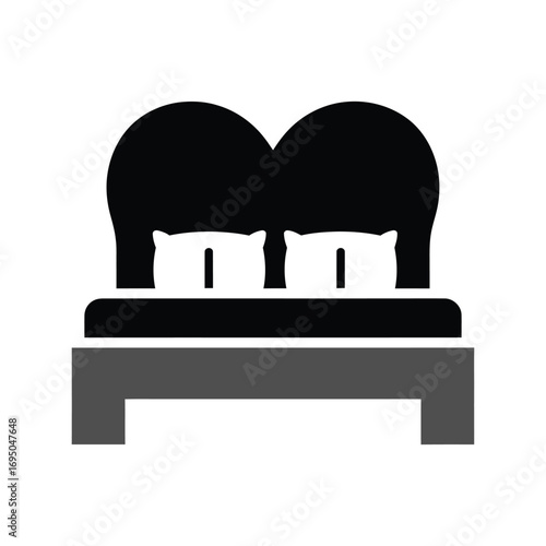Modern double bed with two pillows and headboard icon