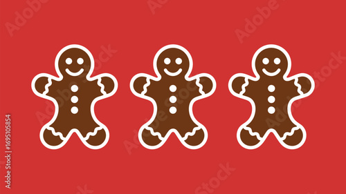 Three cheerful gingerbread cookies with white icing smile on festive red background