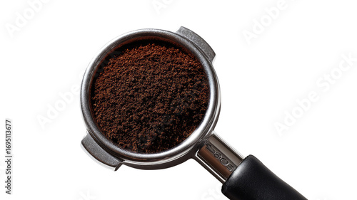 Espresso grounds portafilter closeup; dark background, coffee preparation