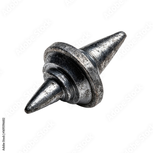 Close-up of a metallic spinning top.  Two pointed tips extend from a circular disc