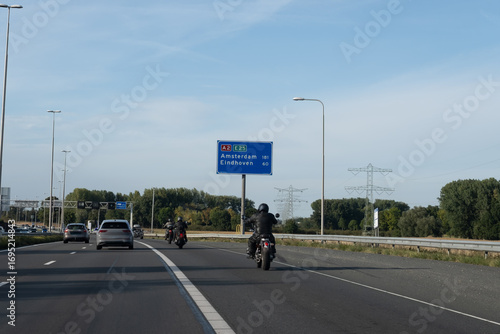 Road transportation in the Netherlands, Dutch highways, road signes, directions, driving car on multi line road, traffic jam in rush hours