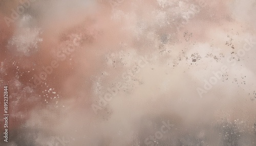 abstract textured background with muted tones of dusty rose beige and gray the image features a mottled speckled effect with variations in color