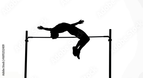Silhouette of an athlete performing a high jump against a stark white backdrop showing focus