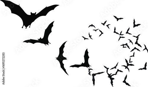 A flock of bats flying in a dark night sky.