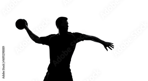 Silhouette of focused male athlete throwing the ball with determination and precision, athletic