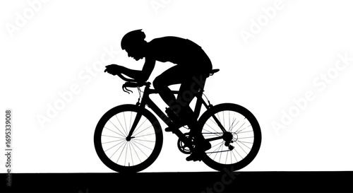 Silhouette of a cyclist in a streamlined posture showcases athletic dedication and competitive