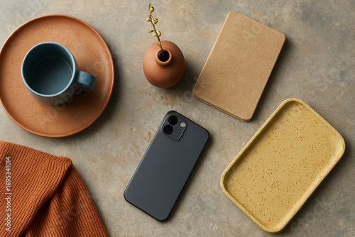 Aesthetic flat lay of modern workspace essentials on a concrete background