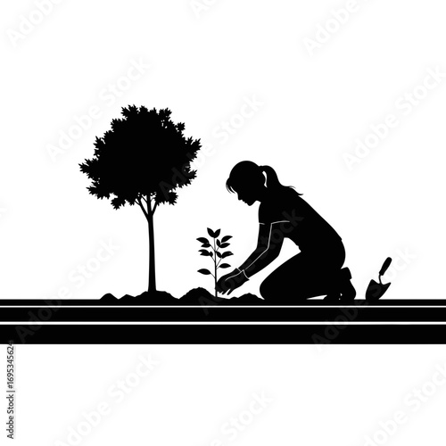 Woman planting a tree silhouette isolated on white background