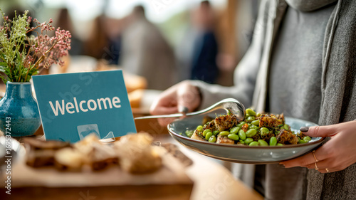 Buffet with welcome sign. Food includes edamame salad. Great for a meeting or party with finger foods.
