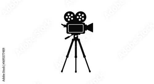 a classic movie camera resting on tripod legs