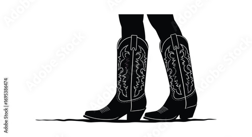 a pair of stylish black cowboy boots with intricate designs