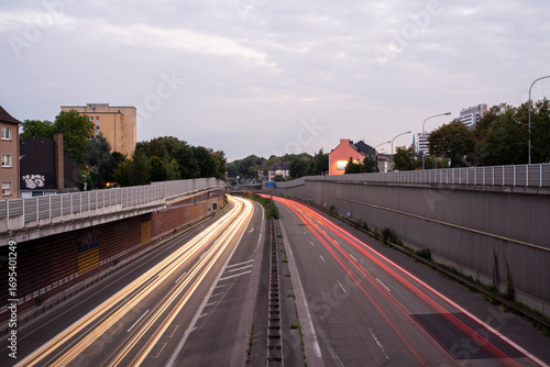 Long exposure traffic light trails on a divided urban highway at twilight