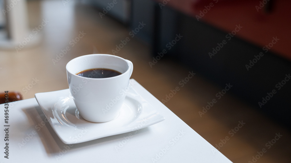 Fototapeta premium Coffee Cup on White Table
