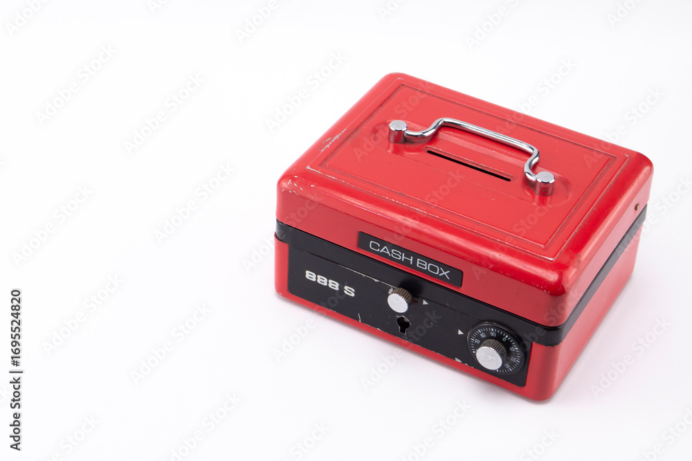 Fototapeta premium Red Cash Box with Black Trim and Silver Handle on White Background, Close-up.