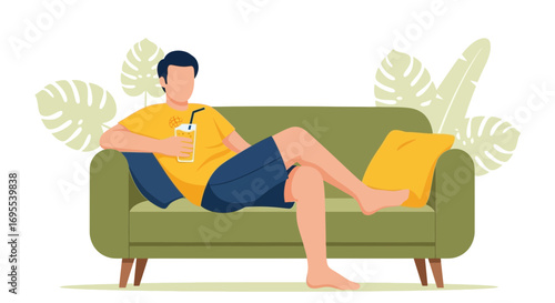 Relaxed Individual Enjoying a Refreshing Beverage While Resting Comfortably on a Sofa