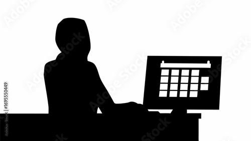 Silhouette of person using computer with calendar application displayed on the monitor screen view online