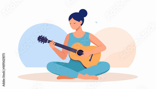 A focused young woman sitting cross-legged on the floor, deeply engaged in practicing and playing her acoustic guitar, representing a creative hobby and musical passion