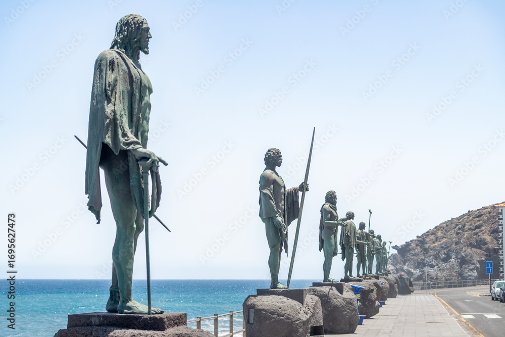Fototapeta premium Statues of the Guanche Kings on the Candelaria Seafront, Tenerife Indigenous Menceyes Monuments by the Atlantic Ocean, Canary Islands
