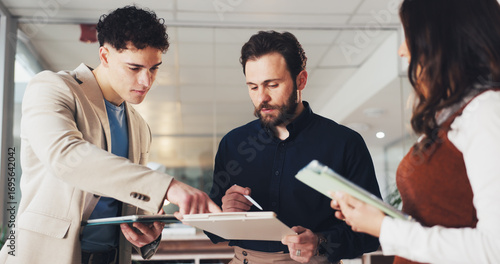 Group, business people and discussion with tablet in office, planning or insurance policy. Technology, meeting and broker talk with team for project, development or proposal for premium coverage