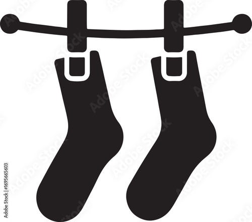 Silhouette vector of a pair of socks hanging on a line. Perfect icon for laundry, drying, and household.