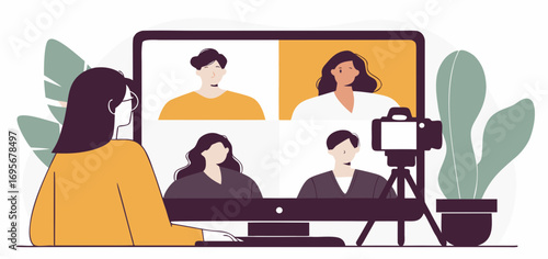 Woman participates in an online video conference with three other people, a camera records the session, plants decorate the workspace.