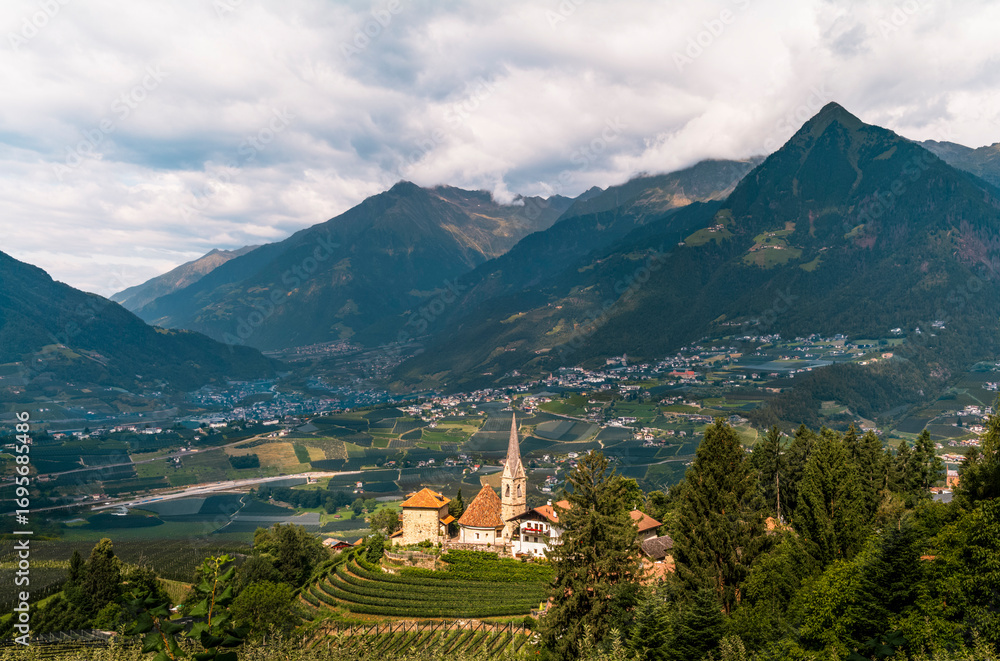 Fototapeta premium View of the village of St. George in South Tyrol with the bowl of the valley of Meran in the background