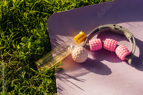 lilac yoga mat on grass with