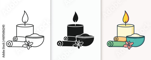 Serene spa scene with burning candle aromatherapy and rolled towels