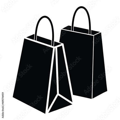 Two black shopping bags with handles isolated on white representing commerce and retail
