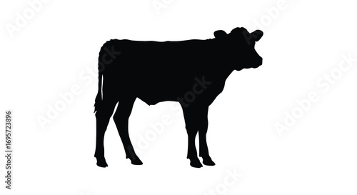 a black silhouette of a cow standing alone