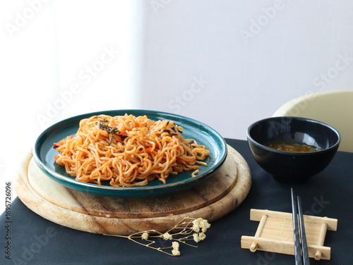 Stir-fried instant noodles with vegetables and meat, a quick and flavorful Thai comfort food dish loved for its savory taste.