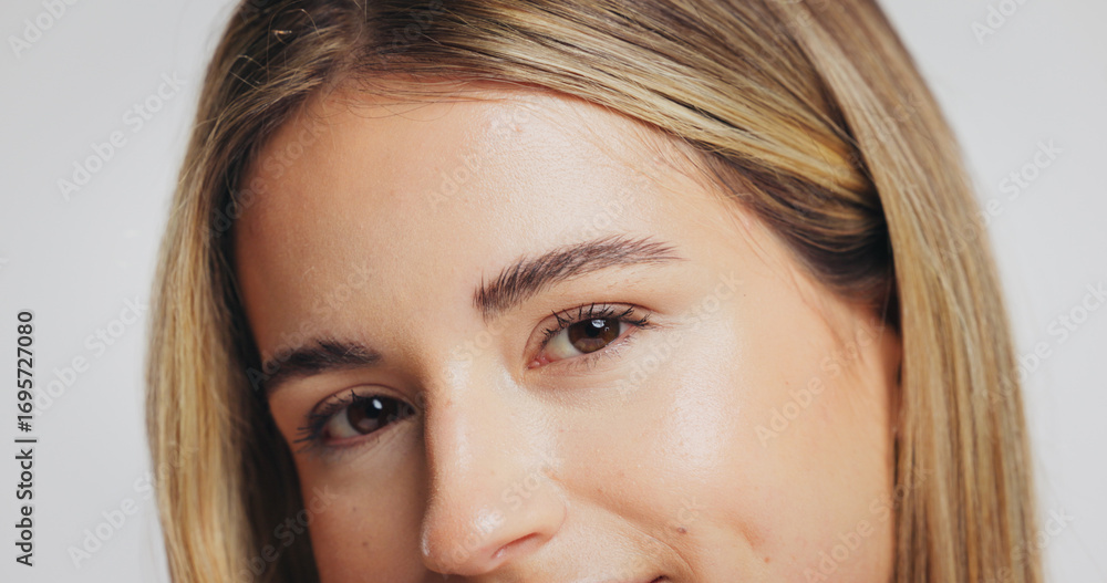 Obraz premium Portrait, woman and beauty for skincare in studio with glow, laminated eyebrows and eyelash extension. Person, cosmetics or natural facial of dermatology shine, treatment results and white background