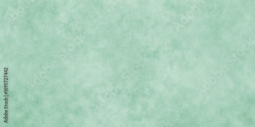 Abstract Elegant dark green background with mottled vintage texture in old fancy background design, texture of colored parchment paper.