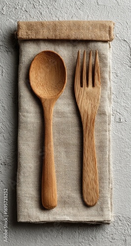Wooden spoon and fork on linen napkin (14)