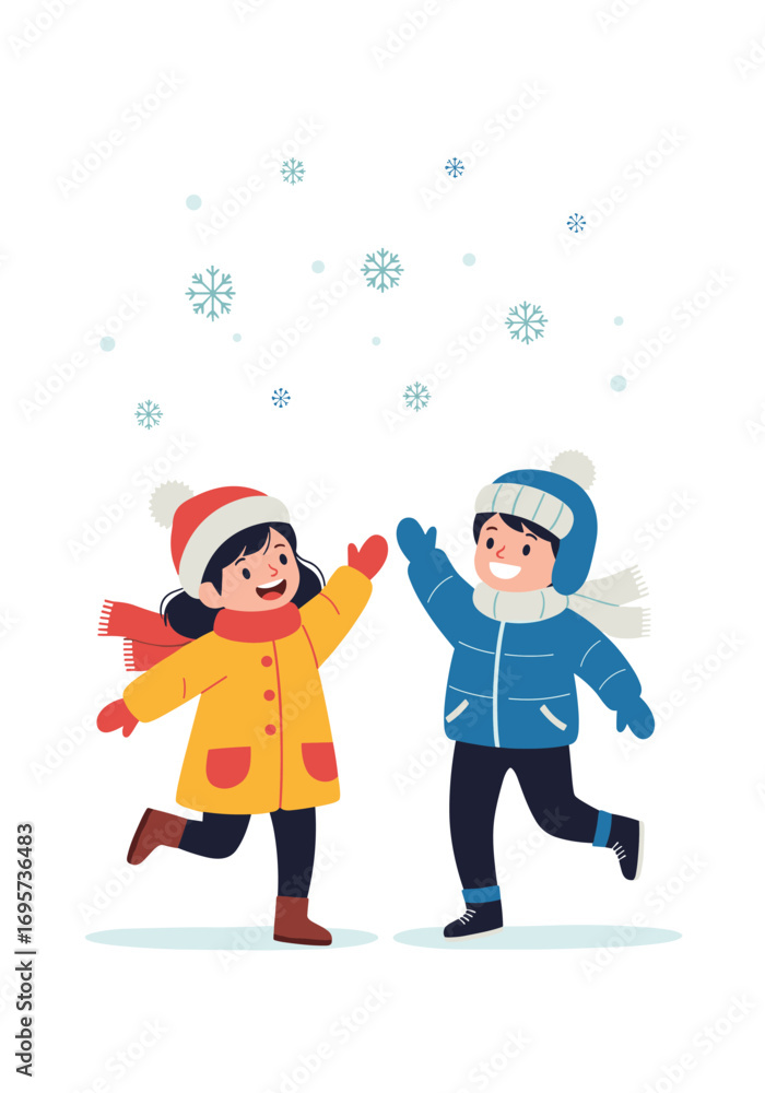 Fototapeta premium Joyful children playing in falling snow during winter season outdoor fun