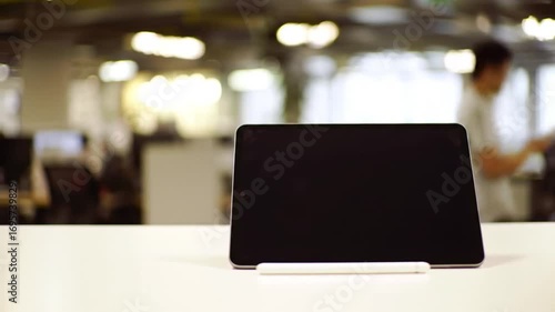 Tablet Displaying Blank Screen in Office Environment Still Life