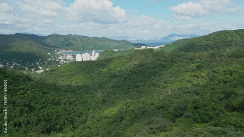 Wallpaper Mural Footage of Mui Wo, a rural town on Lantau Island in Hong Kong, featuring coastal scenery, traditional buildings, lush greenery, and the serene lifestyle of this eastern coastal town. Torontodigital.ca