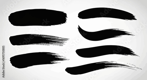 Collection of hand-drawn black ink brush strokes isolated on a grey background. Abstract vector grunge texture elements for artistic design