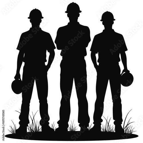 Three construction workers in silhouette with hard hats 