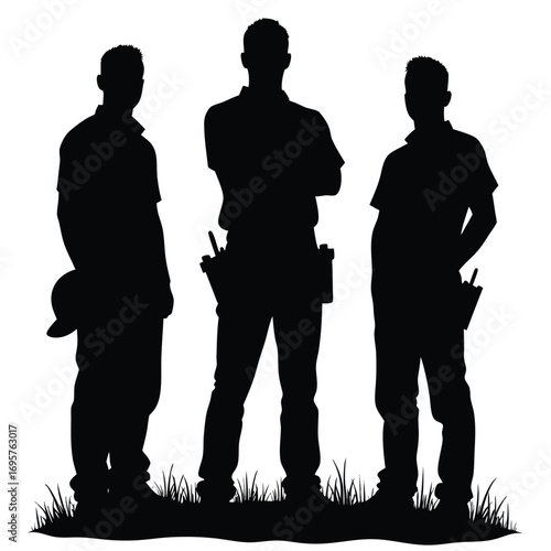 Three construction workers silhouettes standing with tools