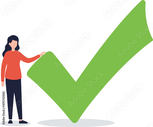 a woman stands beside a large green checkmark symbol