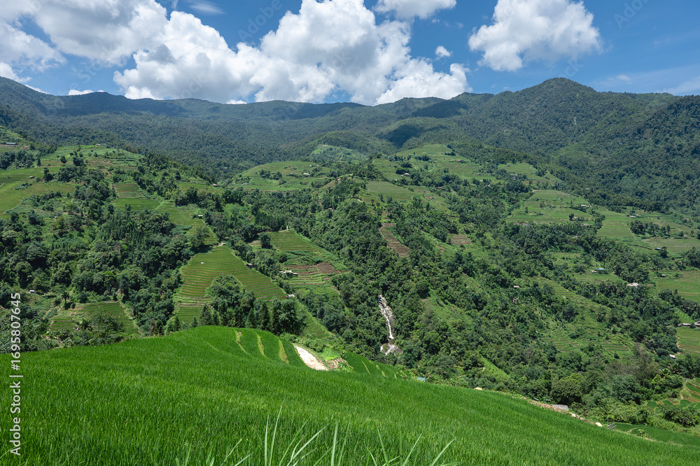 Fototapeta premium Rice terraced fields on Ha Giang Loop and&nbsp;&nbsp;blue cloudy sky in the mountains near Ha Giang in northern Vietnam