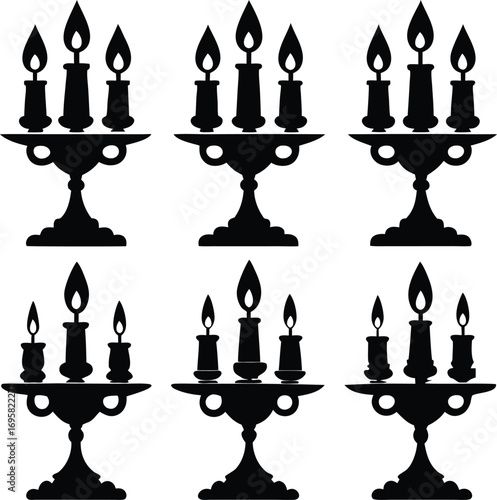 Six black silhouette candelabras with lit candles on a white background collection