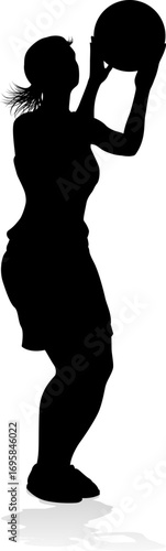 Silhouette of athletic woman female basketball player with basketball ball. Sports concept.